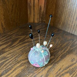 Antique Floral Hat Pin Holder with Two Hat Pins Included.